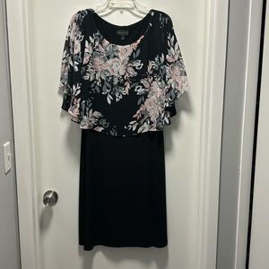 Cape-overlay sheath dress.